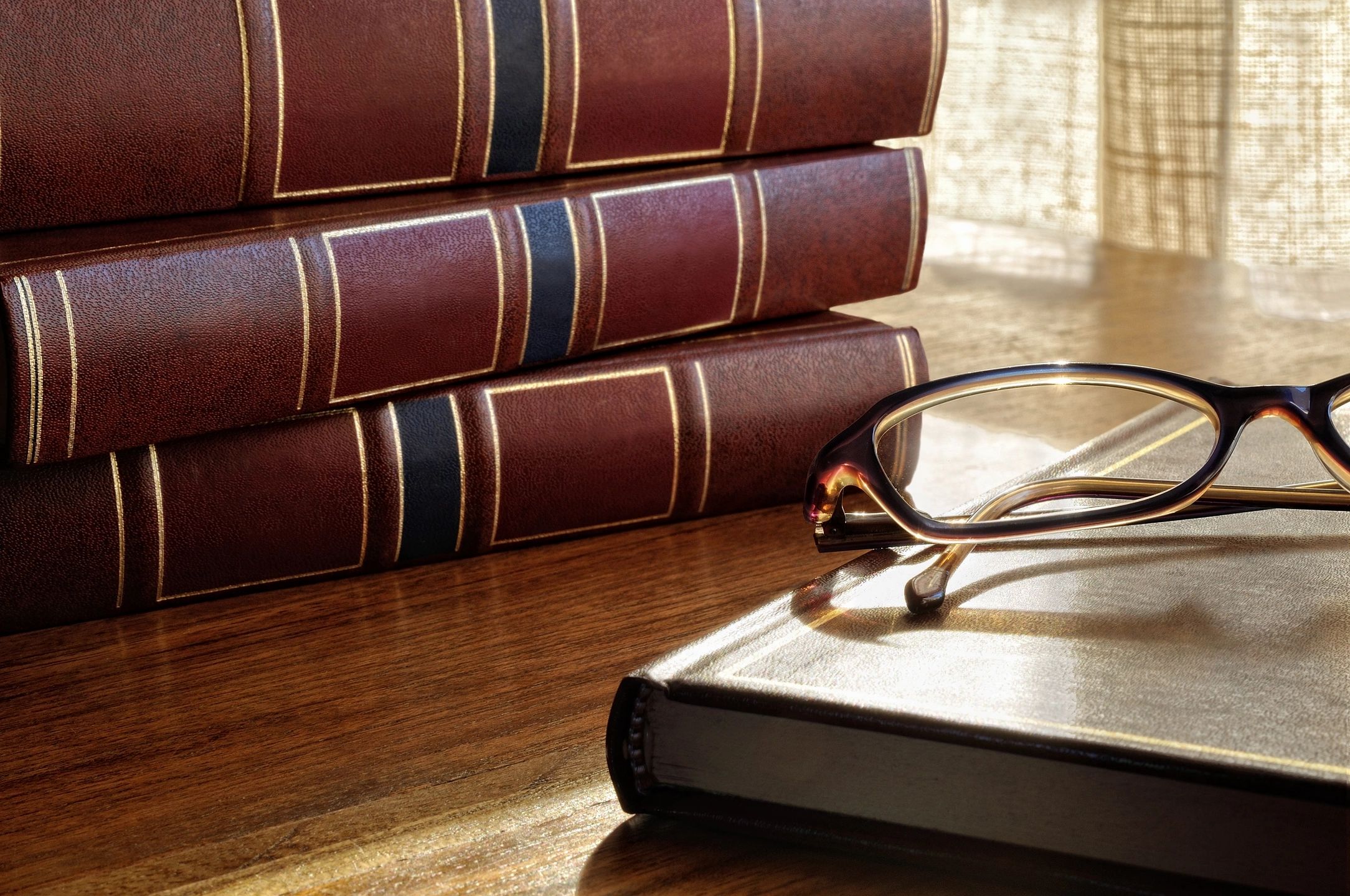 Law books and reading glasses